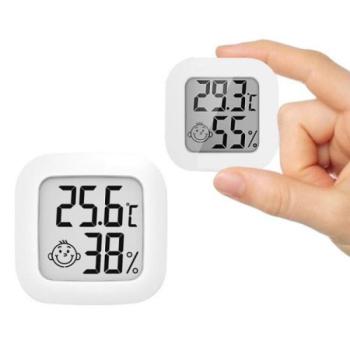 LCD hő és páratartalom mérő, mosolygós és szomorú arc a hőmérséklet és páratartalom alapján kép